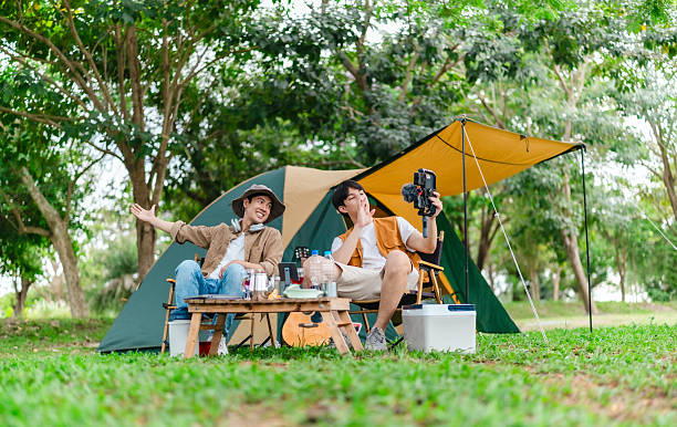 istock Friends Relaxing at Campsite 2221607844