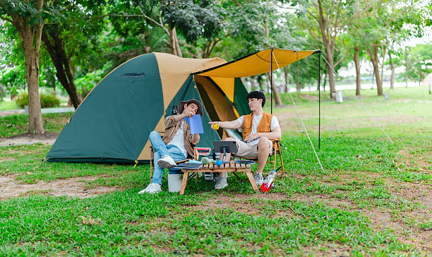 istock Friends Relaxing at Campsite 2221608182