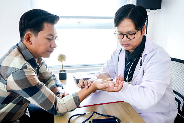 istock Doctor Examining a Patient’s Pulse 2221608255