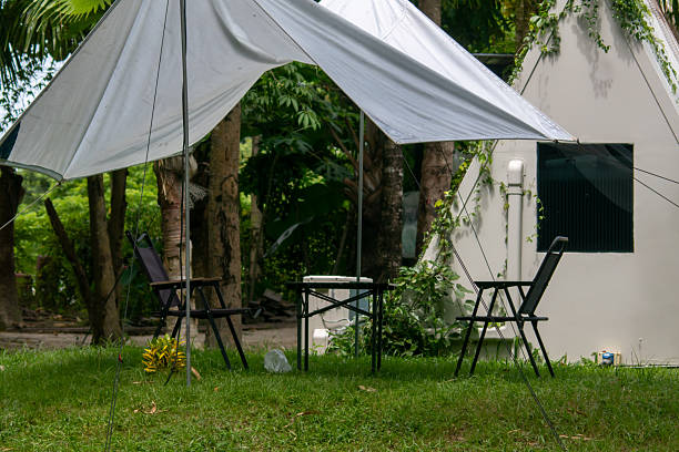 istock Tranquil Outdoor Space with Tent and Chairs 2221609300