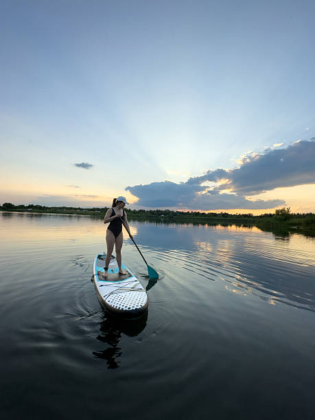 istock Paddleboarding at Sunset on a Tranquil Lake 2221609947