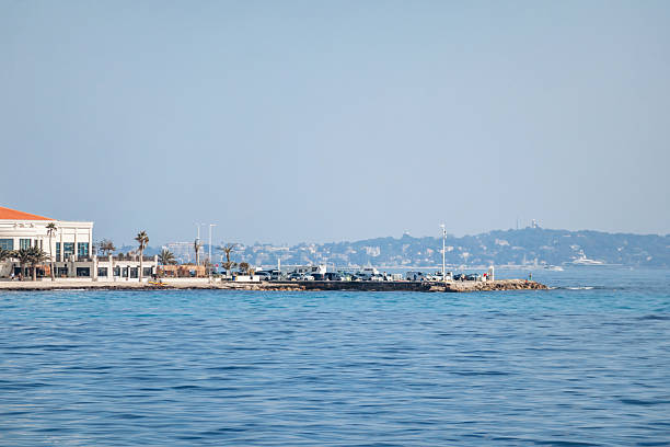 Cannes, France - March 8, 2025: Palm Beach Cannes luxury complex and private beach on Pointe Croisette waterfront