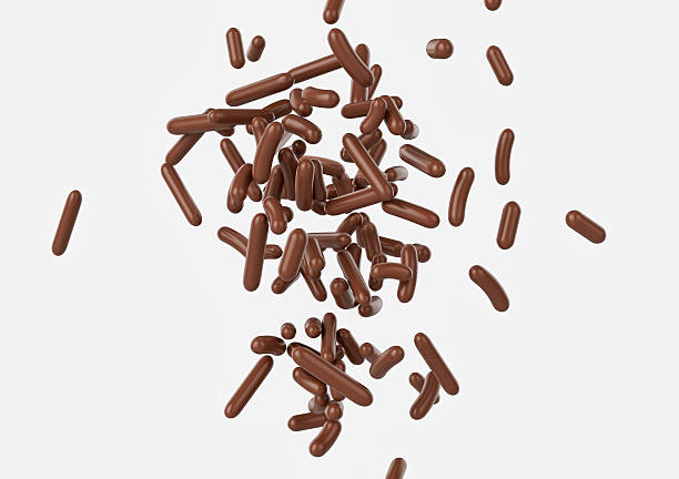 istock Chocolate Sprinkles For Cakes And Bakery Items Falling From Top On White Background 3D Illustration 2221611042