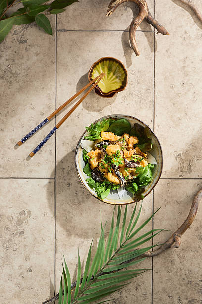 Tempura shrimp on leafy greens, bright natural lighting, overhead composition