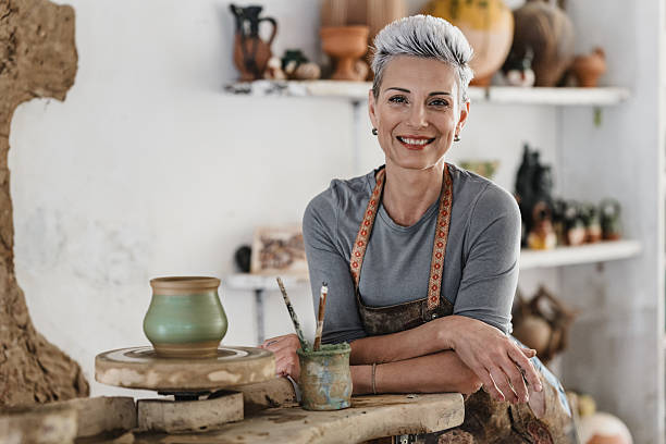 istock Female potter in her studio 2221615934
