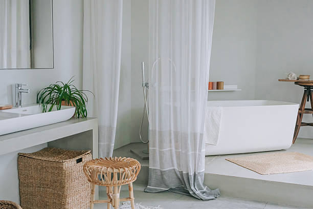 istock Stylish Minimalist Bathroom with Natural Elements and White Curtains 2221617971