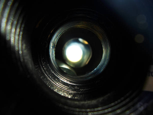 istock Close-up view inside the barrel of binoculars, capturing the inner lens and light reflections. 2221627162