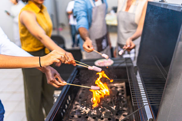 istock Friends roasting marshmallows over a barbecue grill during a festive gathering 2221627465
