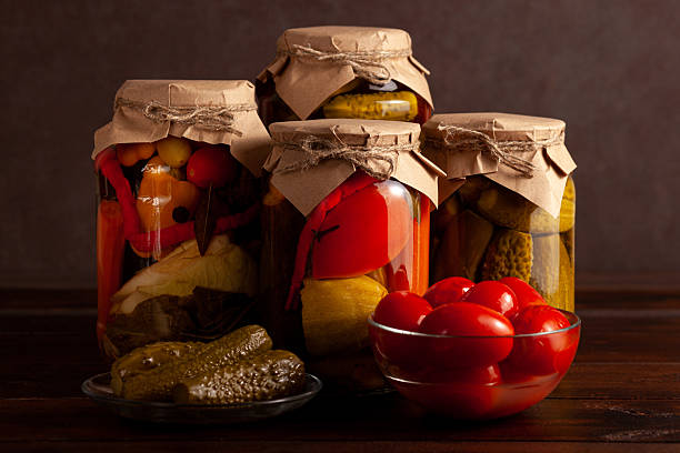 istock Rustic homemade pickled vegetables in jars 2221630722