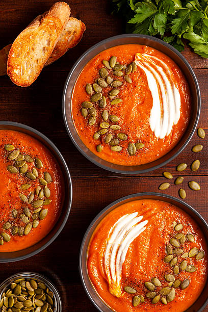 istock Pumpkin Soup with Cream and Seeds. Top View 2221630943