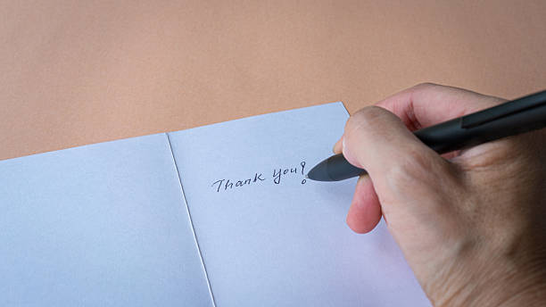 istock Writing a Thank you card 2221632349