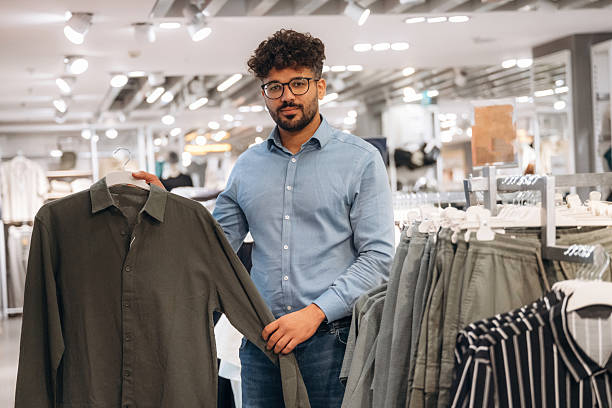 istock Man customer is in the clothing store 2221632679