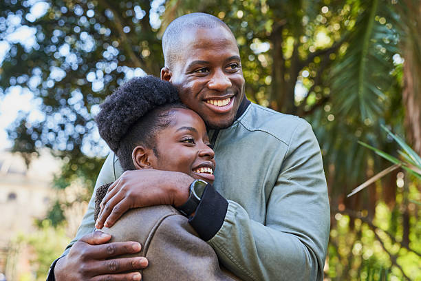istock Joyful Couple Embracing in a Scenic Urban Park Setting 2221634562