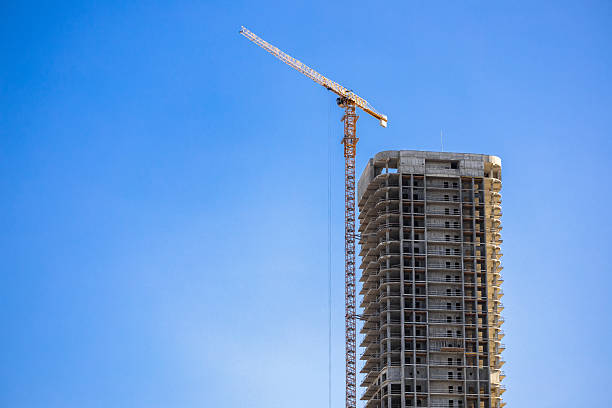 istock Construction crane on Housing. Construction site with buildings under construction. Tower cranes in action. Crane during formworks. Multi Storey Residential Buildings construction. 2221634760