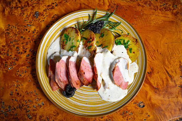 istock Pork fillet with potatoes and sauce 2221635858