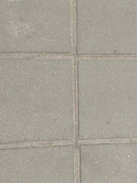 istock Coating with modern textured paving tiles of square shape 2221638049