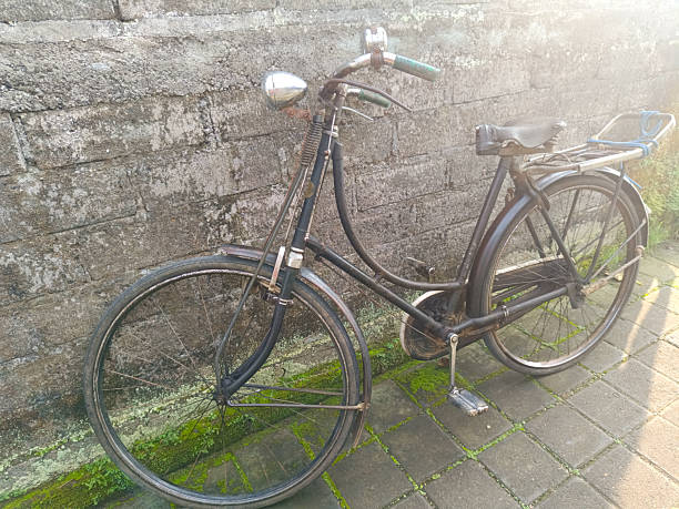 istock Classic vintage style bicycle, leaning against the wall. Old rusty. 2221638500