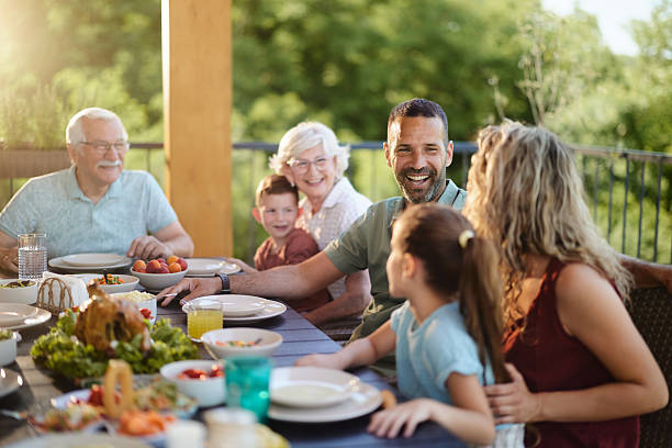 istock Happy extended family talking during lunch on a patio. 2221638968