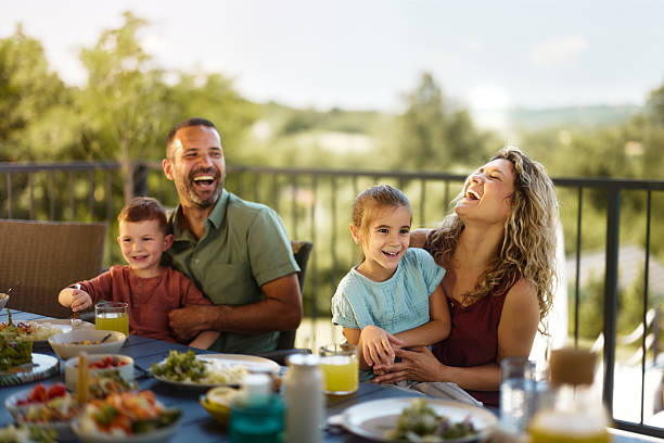 istock Cheerful family having fun during lunch on a patio. 2221640677