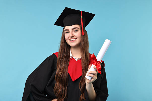 istock Happy student with diploma after graduation on light blue background 2221643330