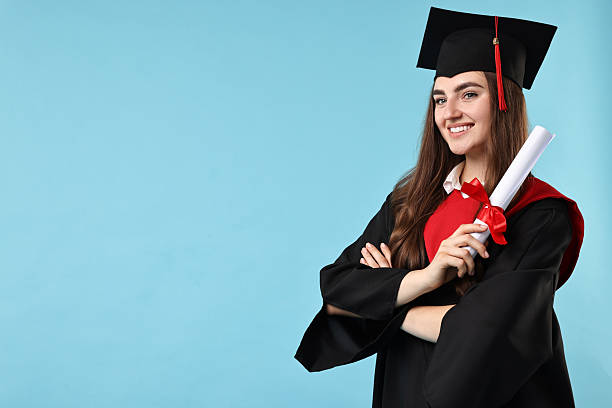 istock Happy student with diploma after graduation on light blue background. Space for text 2221643443