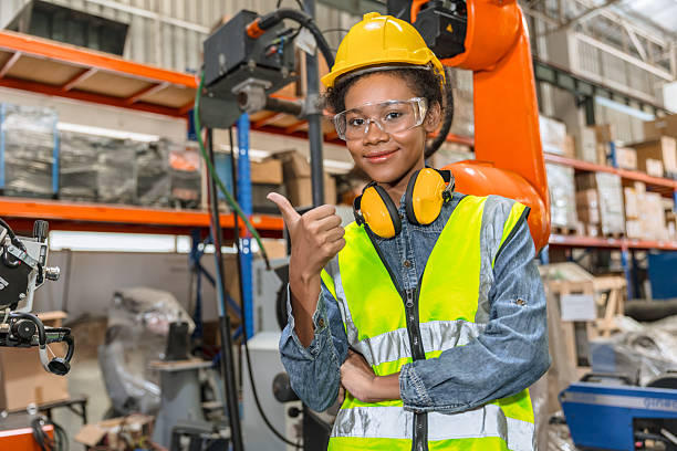 istock professional young engineer, technician work in modern factory industrial robot welding arm machine control operator 2221643843