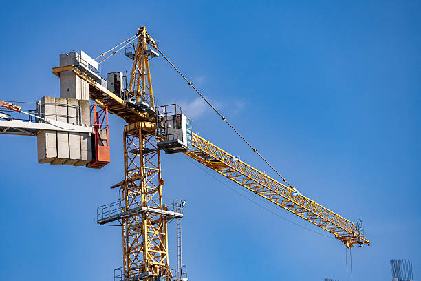 istock Tower crane at construction. Modern crane. Equipment for construction and lifting large-sized loads with construction materials. Construction equipment. 2221644704
