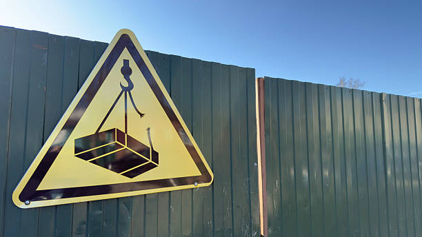 Closeup low angle view of modern Tower crane arm against blue sky, background with copy space, full frame horizontal composition