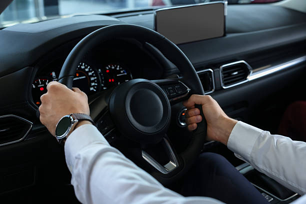 istock Man inside new car in salon, closeup 2221645644