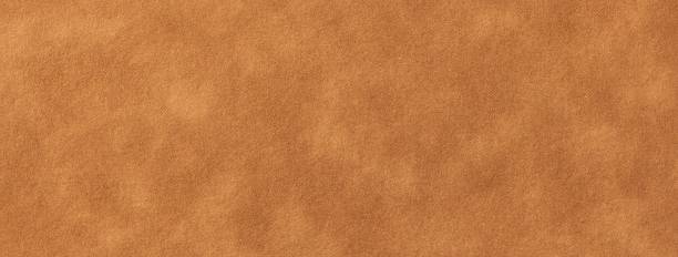 istock Velvet brown paper texture background with vintage fabric effect and soft matte surface. Tan macro backdrop 2221652296