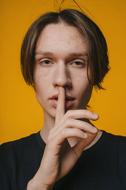 istock A Silent Gesture of Expression Set Against a Vibrant and Colorful Background Space 2221653935