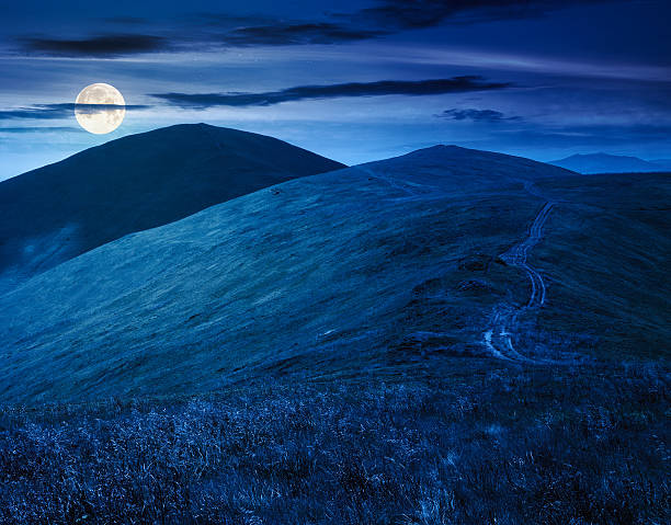 istock scenic mountain landscape with hill at night 2221654126