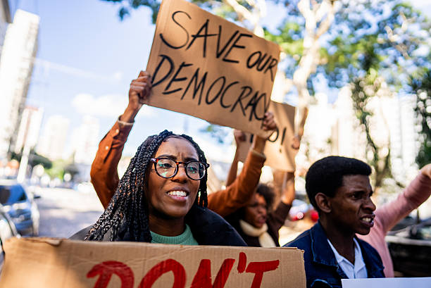 istock Young woman protesting outdoors 2221654401