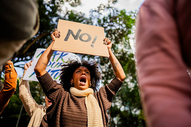 istock Young woman protesting outdoors 2221654454