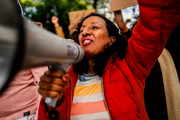 Mature woman protesting outdoors