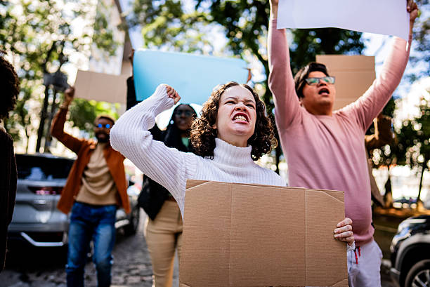 istock Young woman protesting outdoors 2221654706