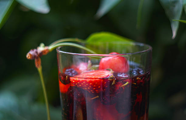 Juice and various fruits are scattered on the board