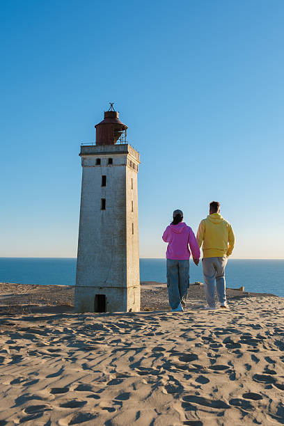 istock Romantic stroll near the iconic lighthouse in Denmark during sunset 2221657538