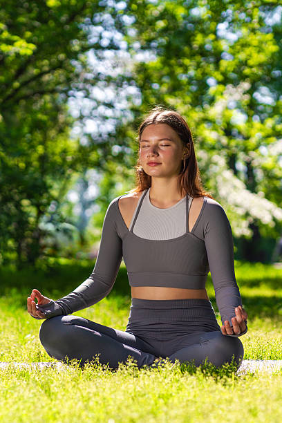 istock Relaxation and mindfulness during outdoor yoga practice in a serene green setting 2221658582