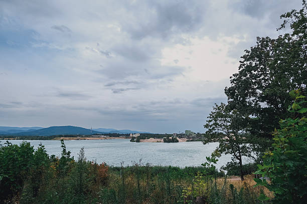 istock Beautiful lake with a cloudy sky in the background 2221660099
