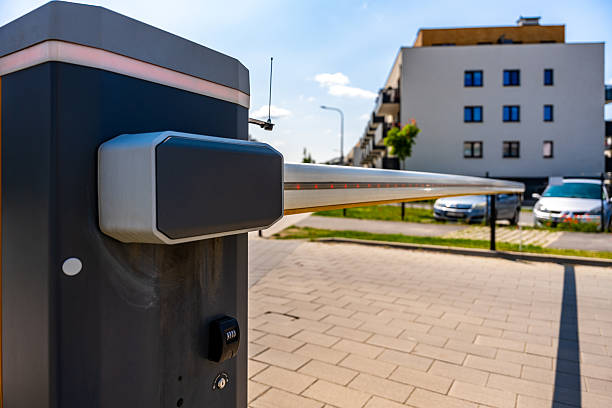 istock Automated security gate barrier in residential complex on sunny day, illustrating modern access control and smart technology 2221662075