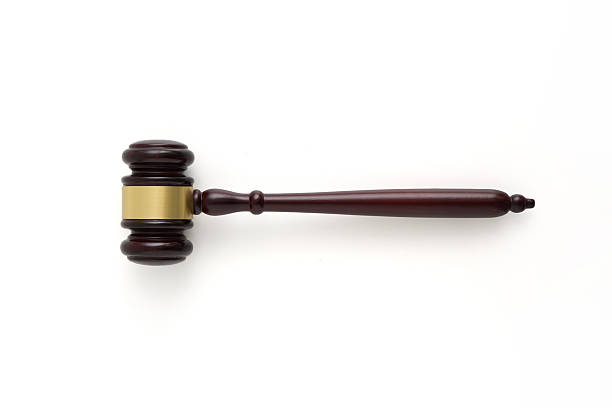 istock Wooden judge gavel top view isolated on white 2221663613
