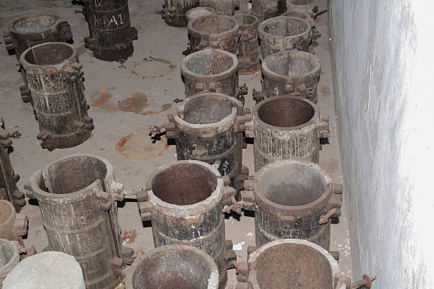 istock Collection of used concrete cylinder molds lined up in a testing laboratory 2221663706