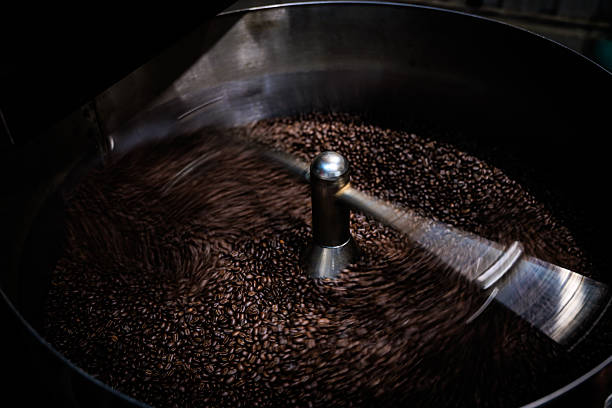 istock fresh coffee beans roasted spinning cover professional machine to soft focus slow shutter speed want to make motion blur of coffee beans detail, 2221663947