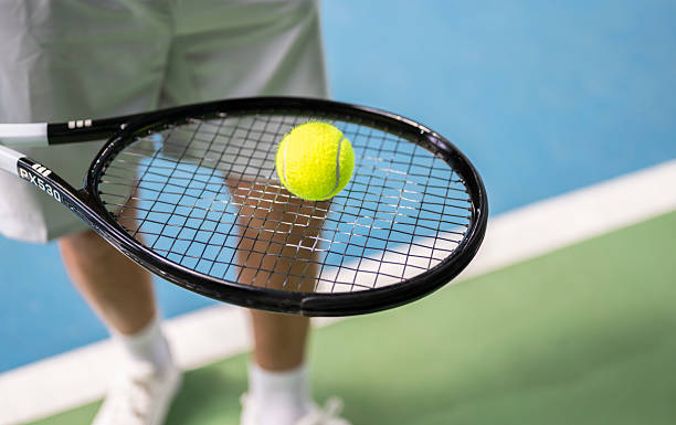 istock Tennis Ball On The Racket 2221664627