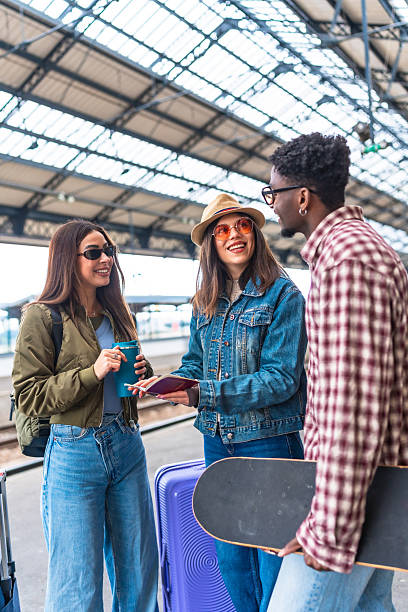 istock Young tourists checking travel documents at train station 2221667054