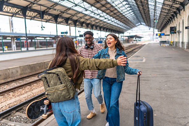 istock Young tourists hugging at train station after arriving 2221667310