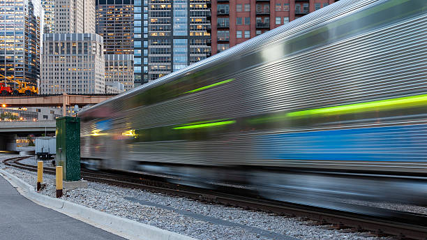 istock Urban background in Chicago, Illinois, with commuter train in motion, 2221667653