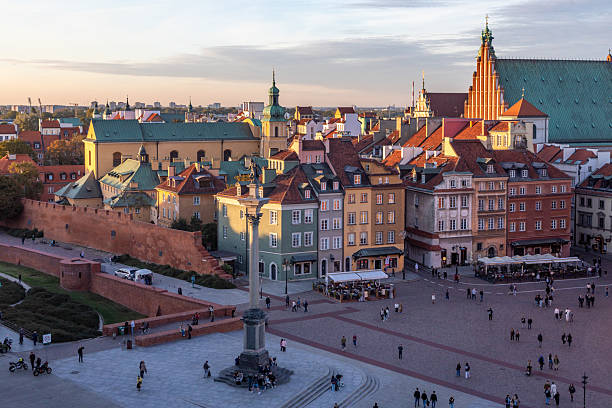 Castle Square, Warsaw, Poland -- October 8, 2024: Historically, a central meeting point and the location of the Royal Castle, residence of Polish monarchs throughout the centuries. Today, it is a hub for tourists and locals for its beautiful architecture, historical significance and vibrant, lively, atmosphere.