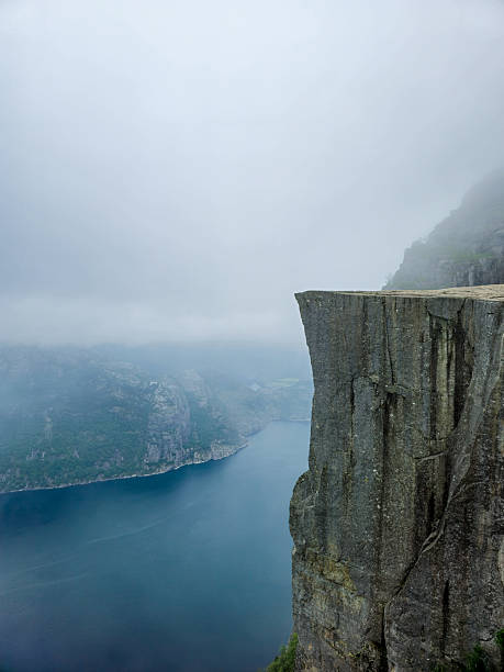 istock Exploring the rugged beauty of Norways breathtaking cliffs overlooking serene waters 2221673160